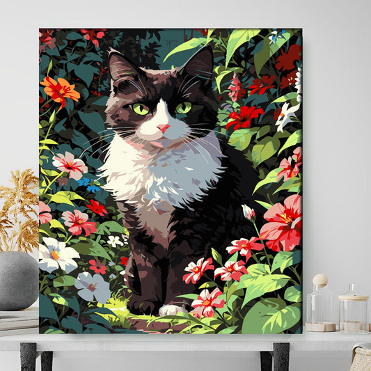 Framed artwork of a black and white cat in a floral garden setting