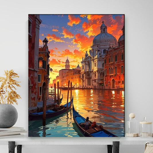 Framed artwork of a cityscape with gondolas and a sunset sky on a white wall.