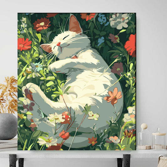 Framed artwork of a white cat among flowers on a wall.