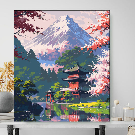 Framed artwork of a Japanese temple with cherry blossoms and Mount Fuji.