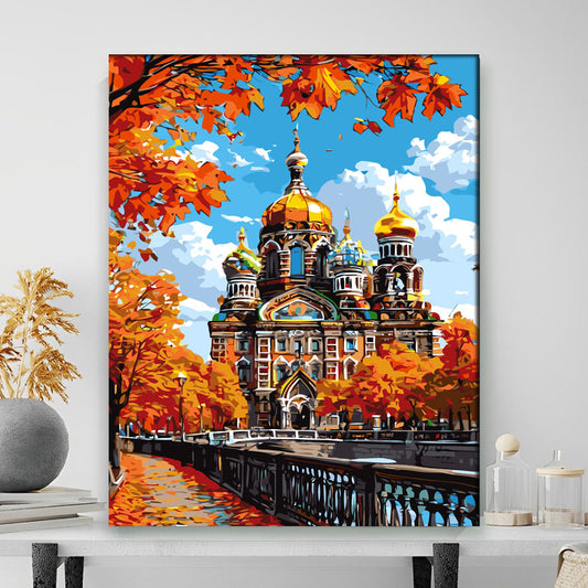 Colorful painting of a St. Petersburg with autumn leaves and trees on a wall.