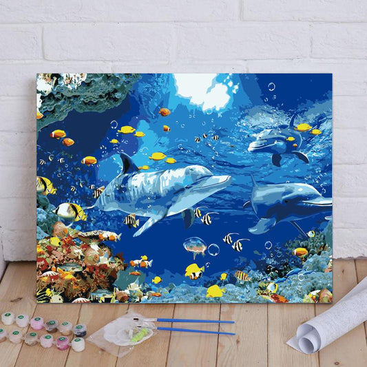 Decorative painting of dolphins and fish underwater scene on a wall.