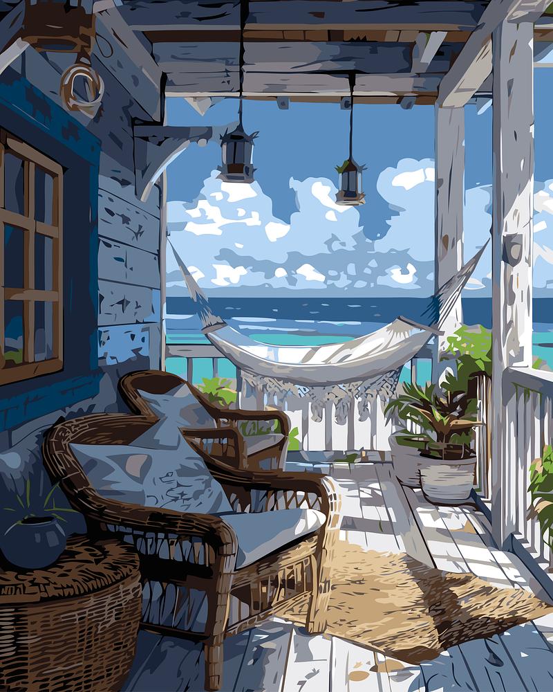 Cozy porch with wicker furniture, a hammock, and ocean view.