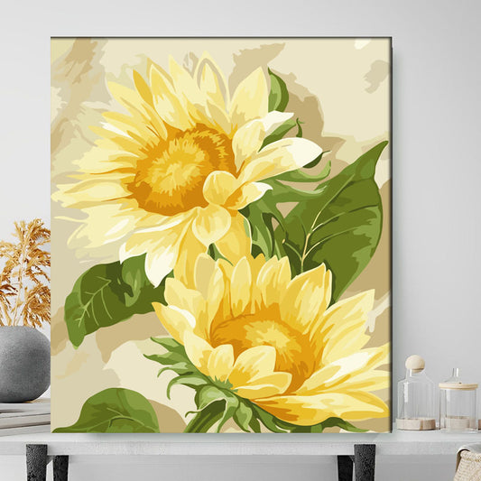 Framed artwork of yellow sunflowers on a neutral background